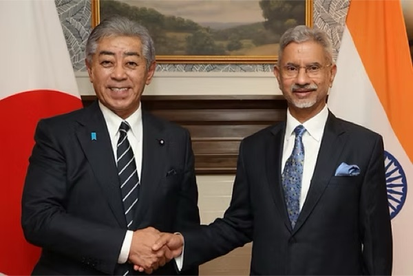 Dr. S. Jaishankar shaking hands with his Japanese counterpart in front of Japanese and Indian flags